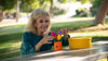 woman playing with sensory silicone flowers for cognitive engagement and dementia therapy