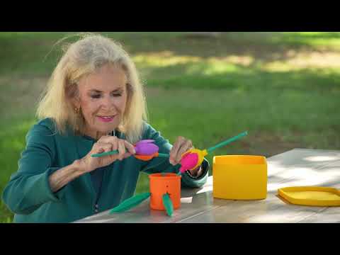 woman playing with sensory silicone flowers for cognitive engagement and dementia therapy