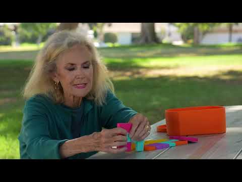 woman playing with Silicone shapes for dementia sensory therapy